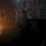 The phrase Wednesday Must Die written in blood on a dark dungeon wall, with Aunt Ophelia standing in front of it in the Wednesday Season 2 finale.