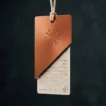 Claude Sonnet 5 pricing shown as a torn discount tag revealing a longer hidden receipt, representing the tokenizer cost increase